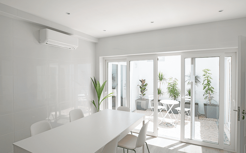 Bright room with table and sliding doors.
