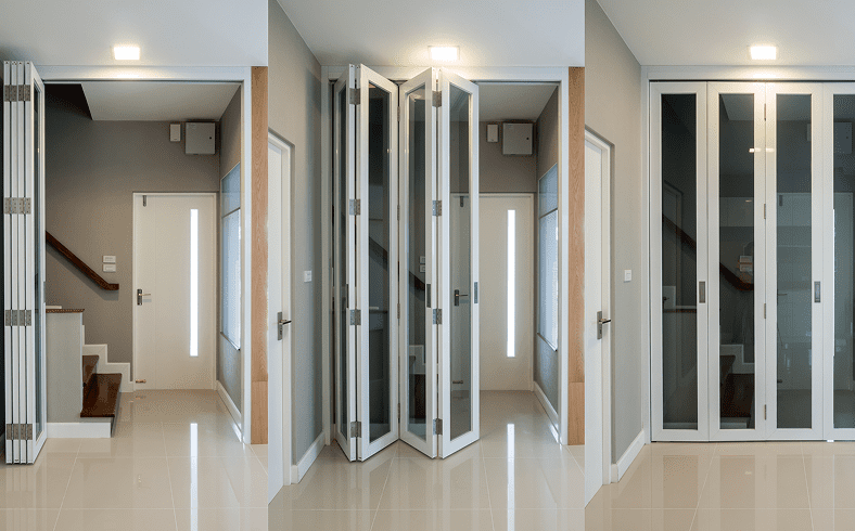 Folding glass doors in modern interior hallway.